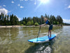 Youth age paddler about 13 or 14 years old on his 9'6 ft maui waterkids surf sup board for kids.  Board can be used in the ocean surfing waves and is also great for paddling on flatwater on the lake.  Lake Tahoe, big smiles and a beautiful summer day to go paddleboarding