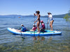 Women paddling with kids on their inflatable paddle board.  4 person mantaray isup great for families and beginners learning to paddle