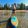 Beautiful image of a 12 year old girl on her Waterkids paddle board for kids at lake Tahoe California. Incredible emerald color and crystal clear water with amazing mountain views and blue sky with a wooden pier in the background. Girl paddleboarding in perfect glassy conditions on lake Tahoe sup boarding on the best kids paddle board the 8ft stingray made and designed by local paddlers. The caption reads great style for boys and girls.