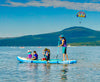 Inflatable Paddle Board 4 Person Family SUP.  Woman on paddle board with 4 kids at lake tahoe.  mom paddling isup with kids