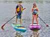 2 Kids on their waterkids paddle boards.  The 10 year old boy is on his Tahoe sup that has a wood bamboo top and the 9 year old girl is on her award winning 8ft hardtop lotus for girls.  Kids are paddleboarding and smiling having a great day