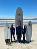 Waterkids team surfers at the beach with their kids size surfboards getting ready to get in the ocean and catch waves