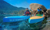 Waterkids paddle boards & surfboards main website image of 2 boys sitting on their kids paddle boards at Lake Tahoe.  Beautiful clear turquoise water with white granite rocks, mountains and blue  skies in the background.  Waterkids makes the best kids paddle boards on the planet