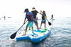 3 youth boys on a waterkids mantaray huge inflatable paddle board for families, camps, schools & more.  Boys with life jackets paddle together on 1 paddleboard at the lake.
